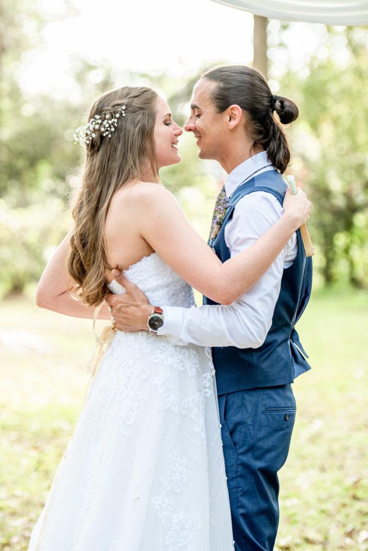 bride and groom at their Outdoor Wedding Ceremony at The Garden Villa Venue in Orlando, FL